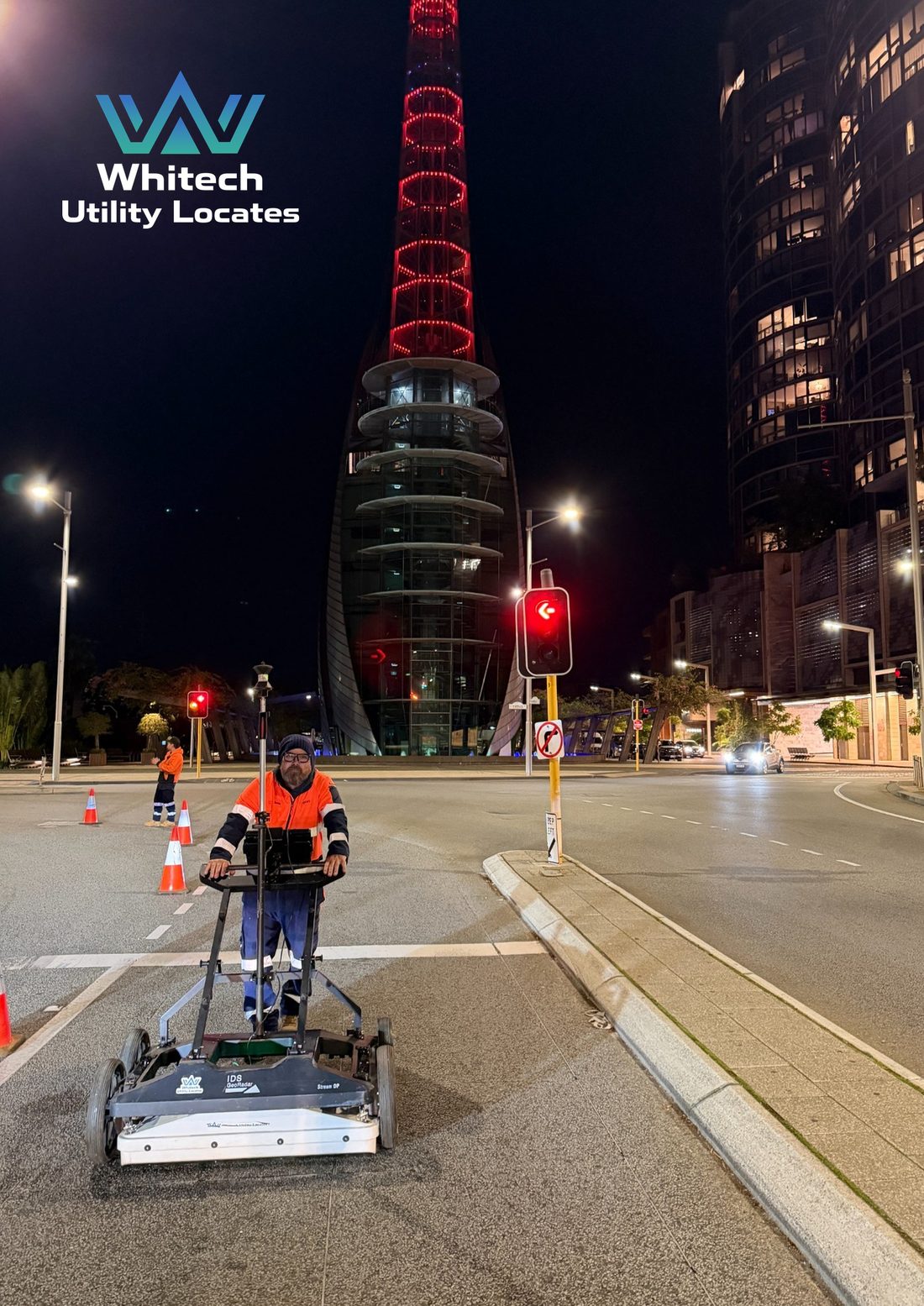 Whitech operator running a multi-array GPR system past the Bell Tower in Perth at night